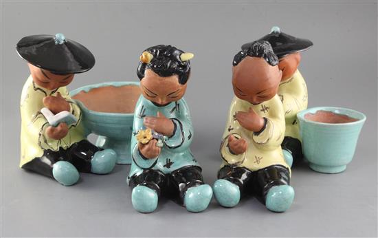 Gudrun Baudisch (1907-1982). A set of four Wiener Werkstatte tin glazed terracotta figures of China men, 21.5- 22cm high